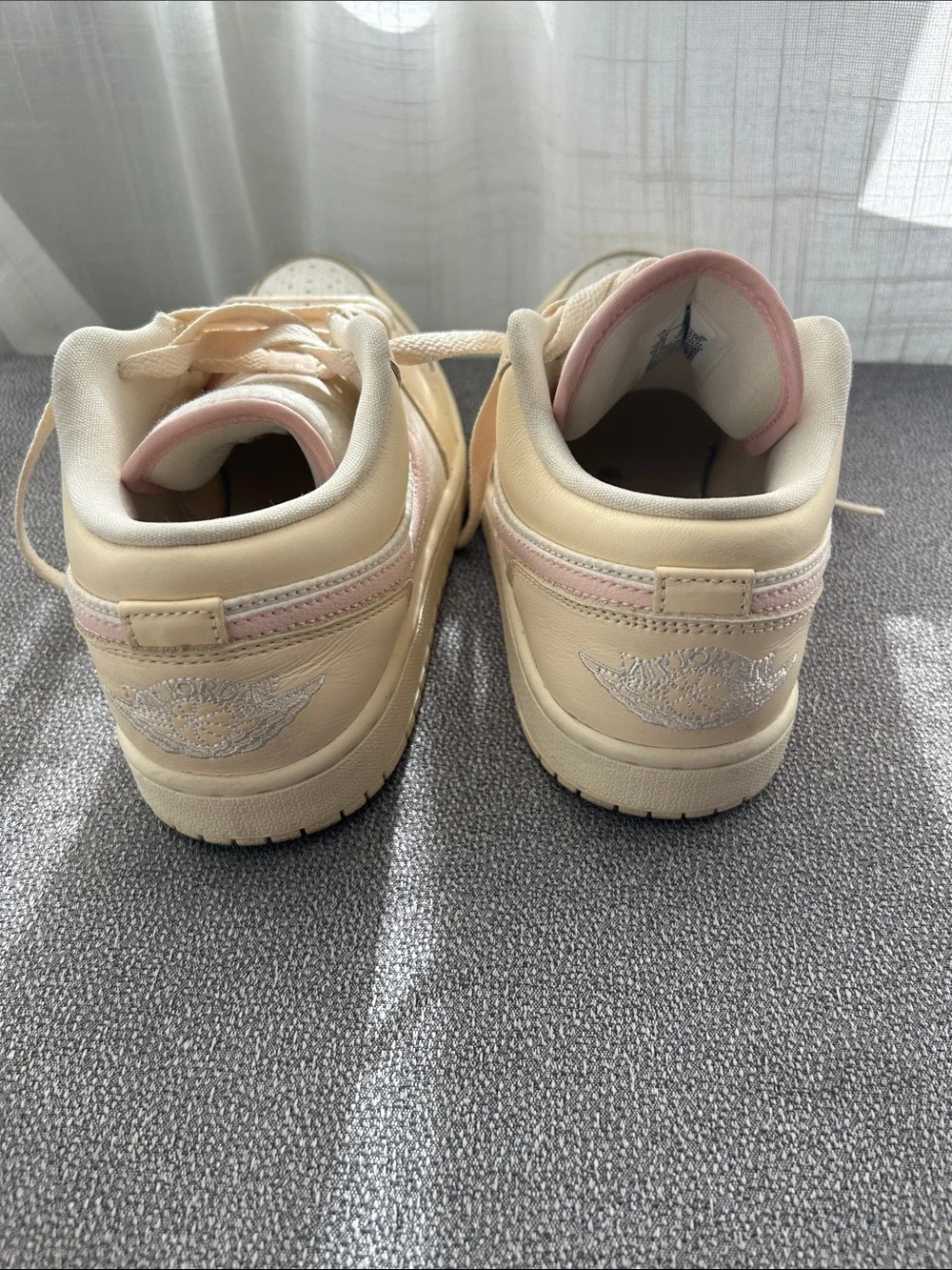 Nike Women’s Low-Top Sneakers in Cream with Pink Swoosh